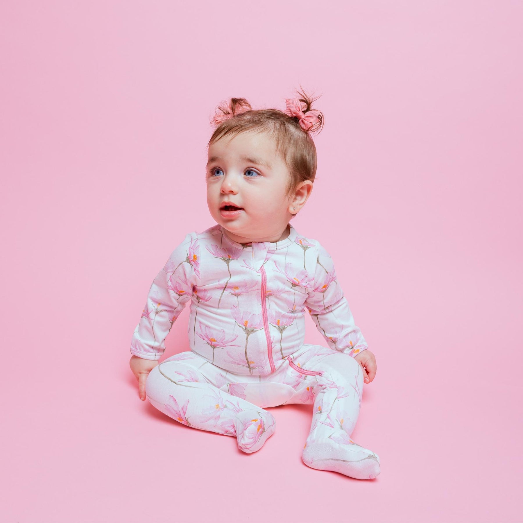 Norani Baby Footed ZIpper Onesie in Pink and White Petal Flowers