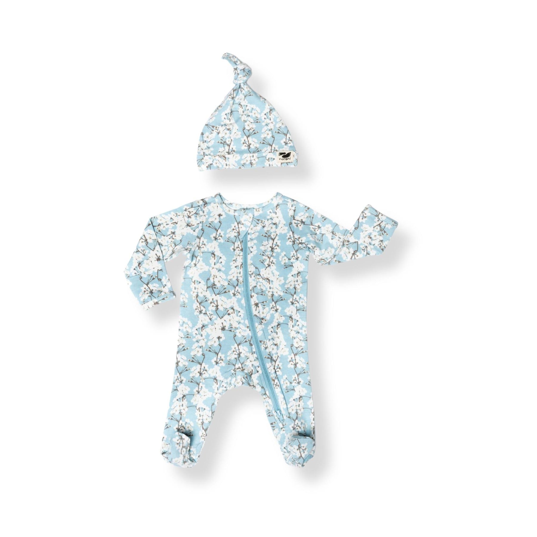Norani Baby footed zippered onesie in blue and white cherry blossom flowers