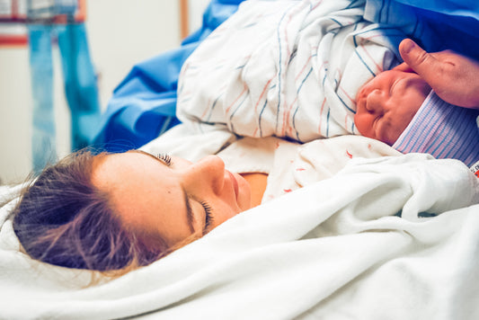 Mother Holding Baby After Delivery