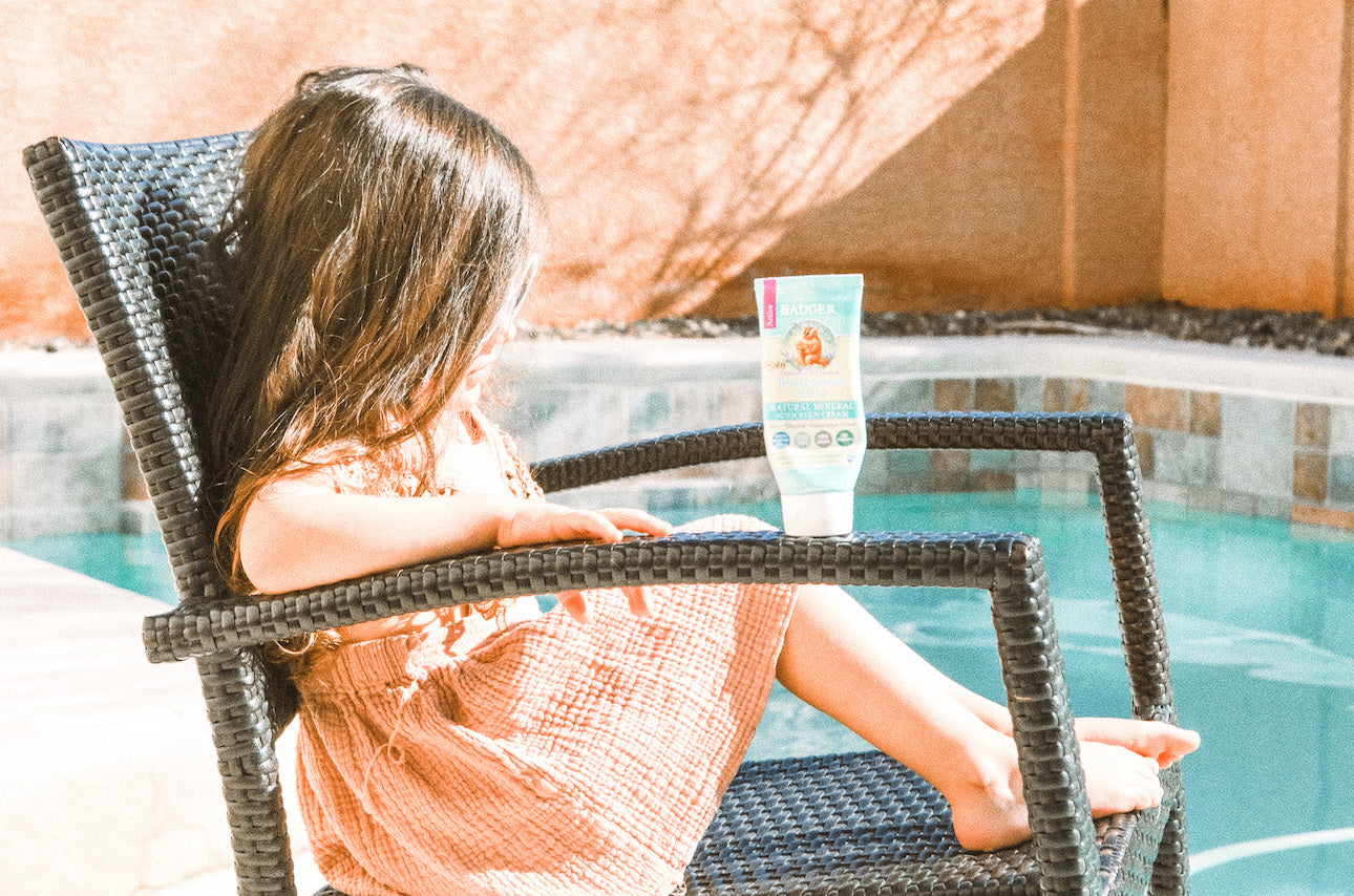 Girl With Sunscreen By Pool