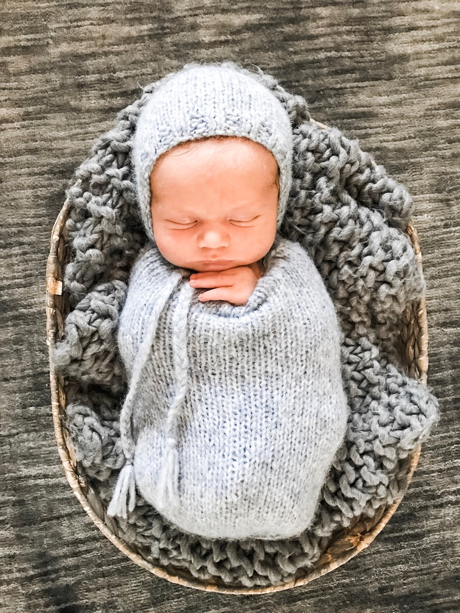 How to Swaddle a Baby With One Hand Out