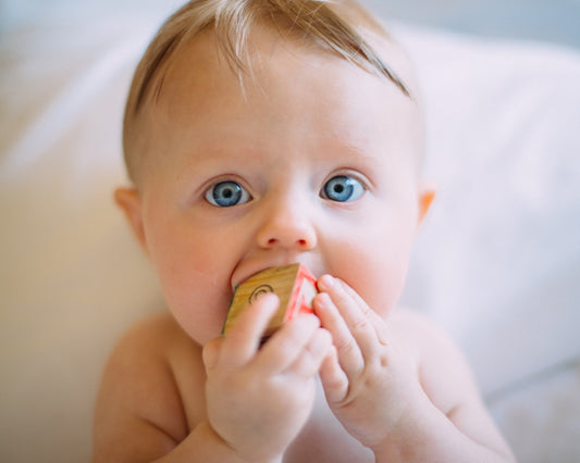 blue eyed baby playing