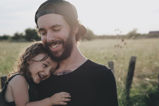 father daughter hugging outdoors