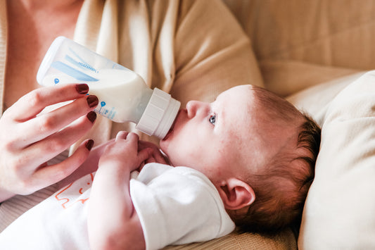 Baby Drinking Milk From Bottle