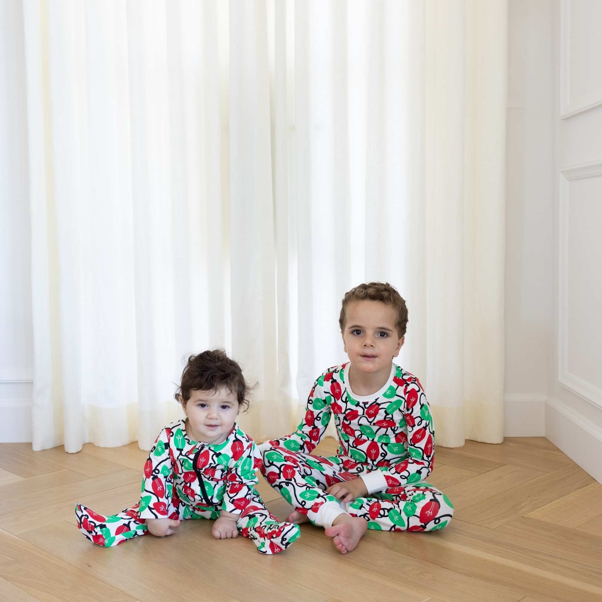 Norani Baby Holiday Collection Footed Onesie + Toddler Pajamas- Festive Lights