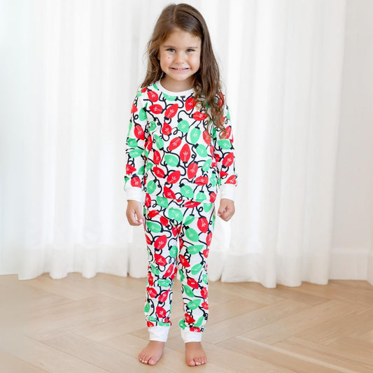 Norani Baby Holiday Pajamas for kids in bright red and green lights
