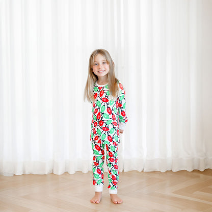 Norani Baby Holiday Pajamas for kids in bright red and green lights
