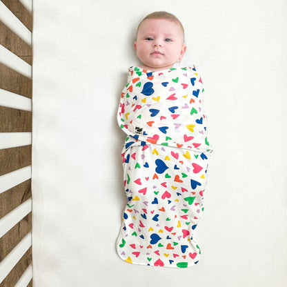 Norani Baby snugababe swaddle pod in colorful hearts