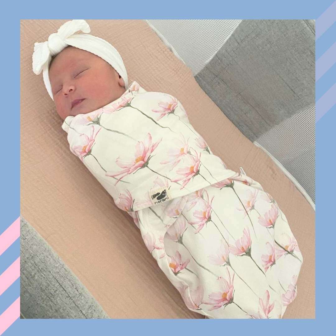 norani baby snugababe sleep pod in Pink and white petal flowers