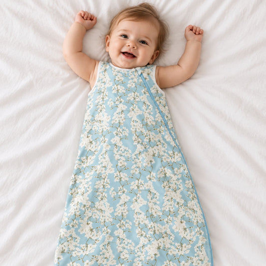 norani baby cherry blossom print sleep sack with baby smiling