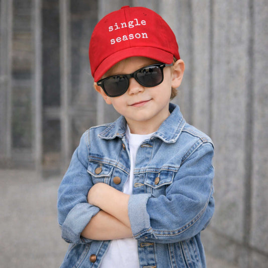 boy wearing single season hat looking at the camera