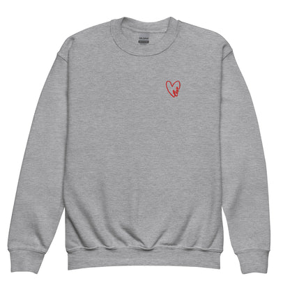 Grey crewneck sweatshirt shown in a clean product shot, featuring a subtle embroidered heart on the chest, highlighting the soft fleece fabric, classic fit, and cozy everyday feel.