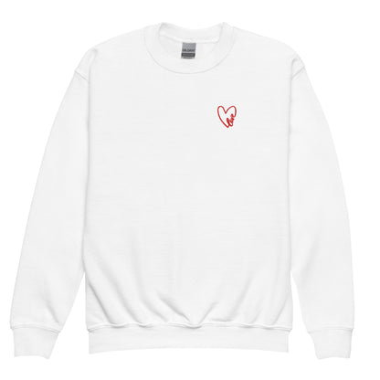 White crewneck sweatshirt shown in a clean product shot, featuring a subtle embroidered heart on the chest, highlighting the soft fleece fabric, classic fit, and cozy everyday feel.